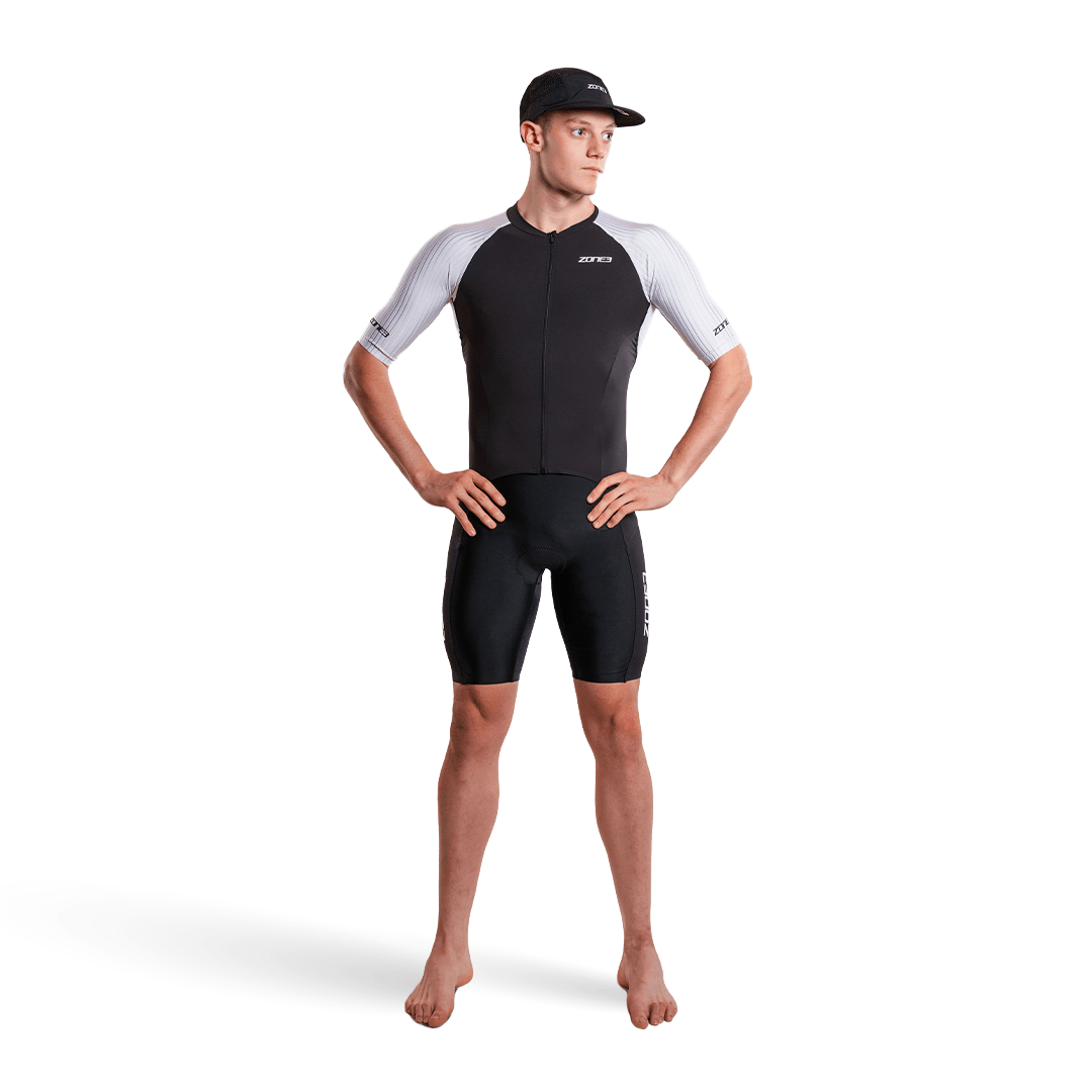 Man wearing Lava Long Distance Full Zip Short Sleeve Trisuit on a white background