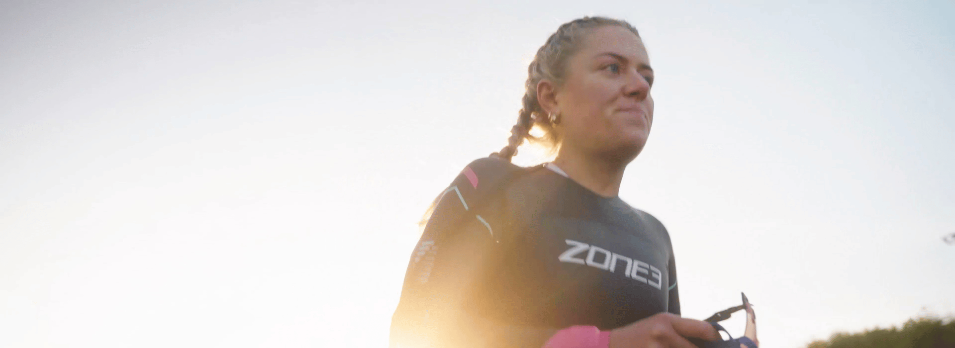 anya culling is getting ready for her triathlon swim, wearing her zone3 agile wetsuit