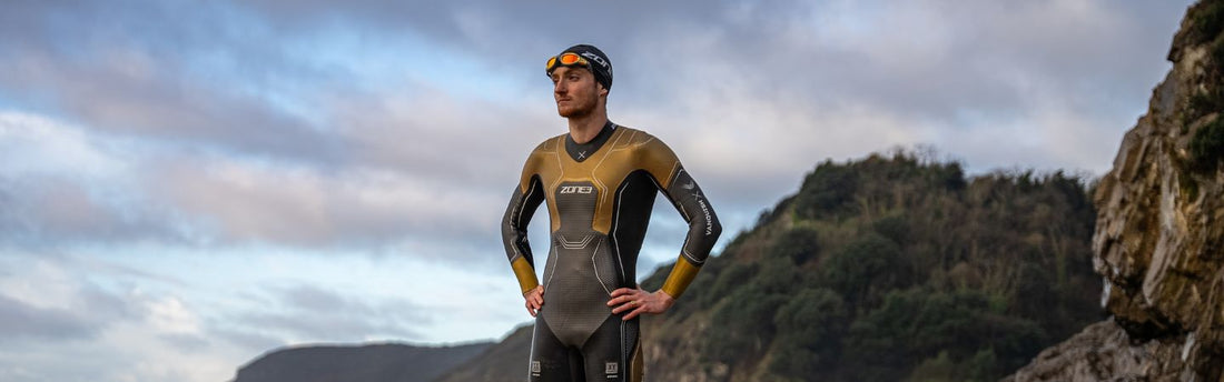 Harry Palmer professional triathlete wearing the gold vanquish x wetsuit 