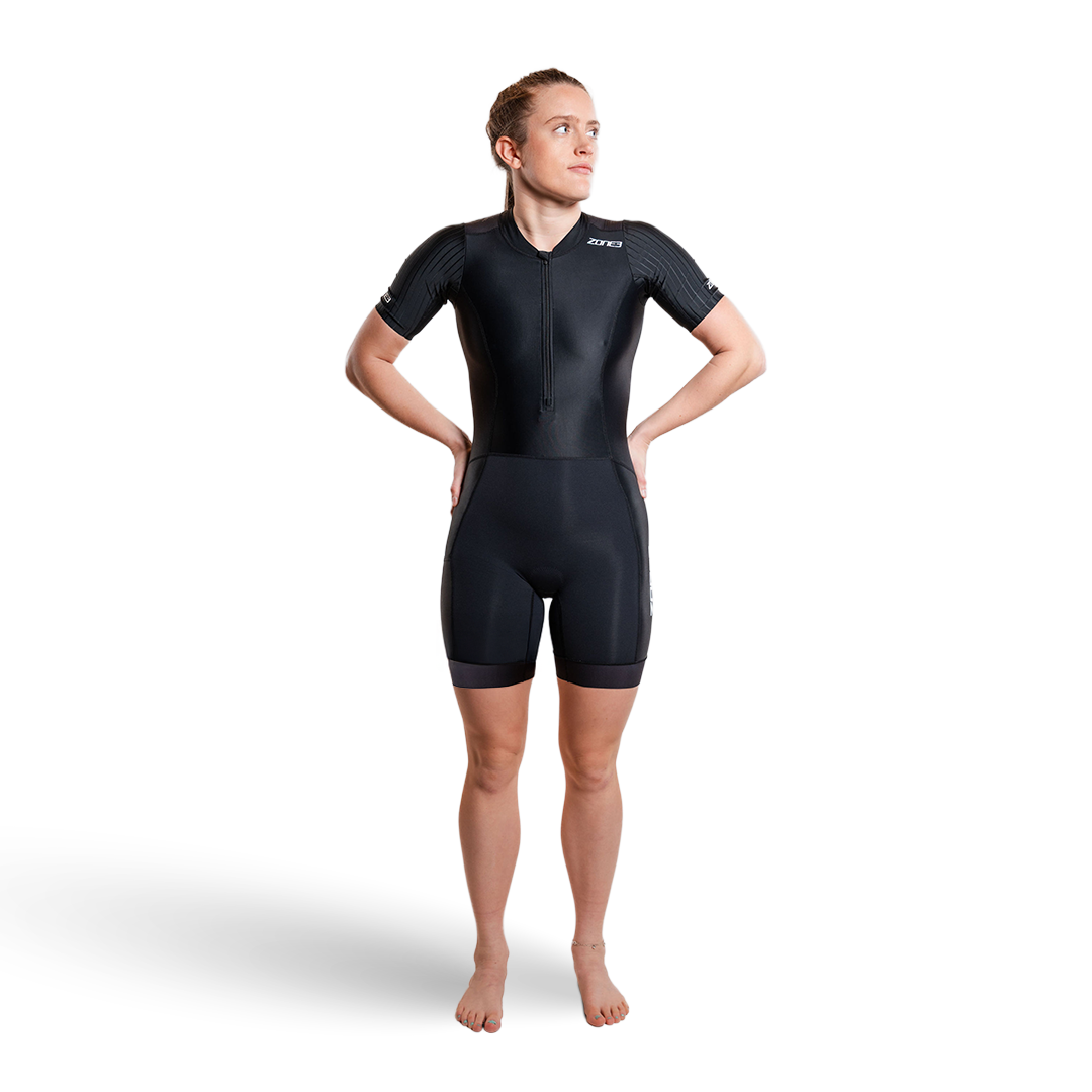 Person wearing a black trisuit on a white background