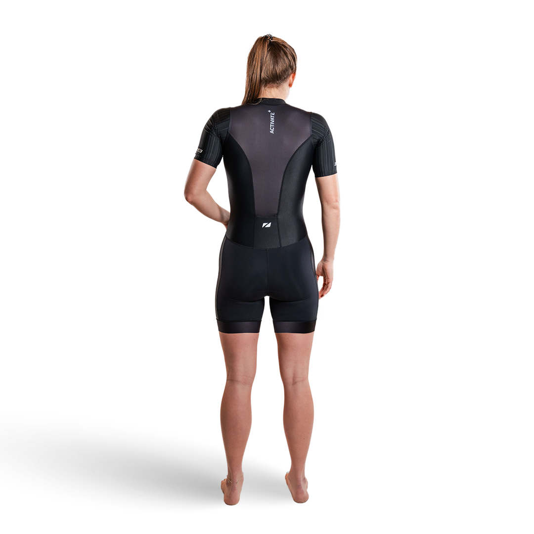 Person wearing a black trisuit on a white background