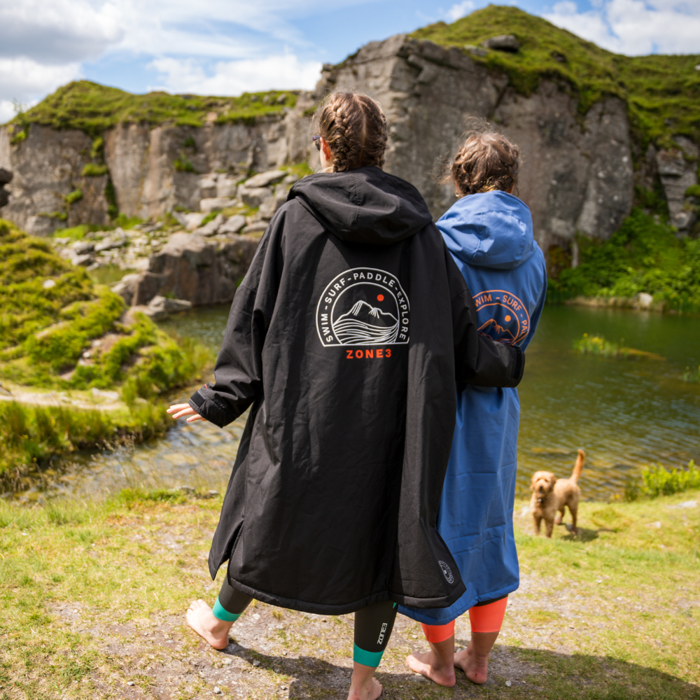 Back view of person wearing Active-Flex changing robe with arm around another person 