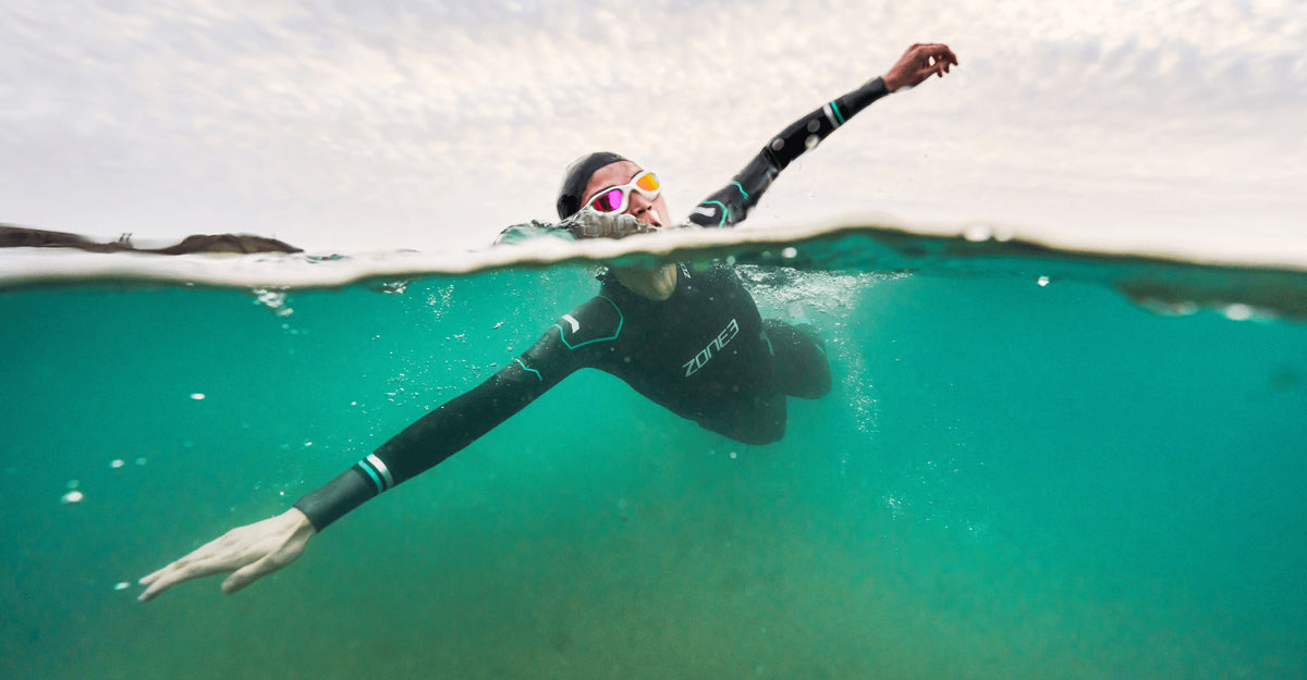 Athlete wearing the Zone3 Advance wetsuit in open water. 