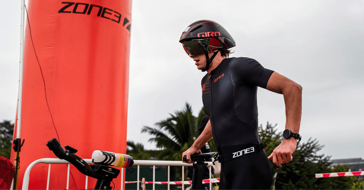 Man wearing zone3 Aeroforce-X Trisuit at a race event with a helmet 