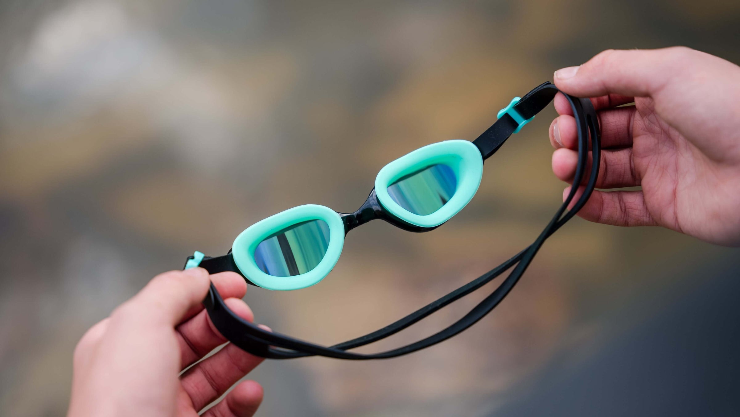 hand holding the Aquahero Goggles 