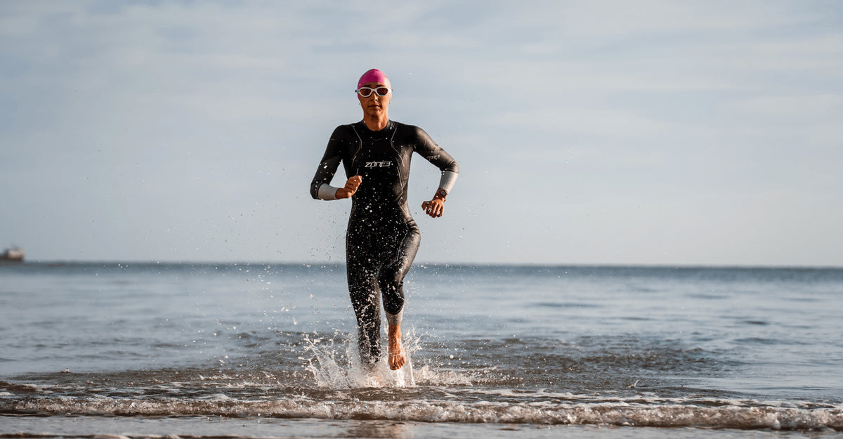 An athlete wearing the Zone3 Aspire wetsuit in open water