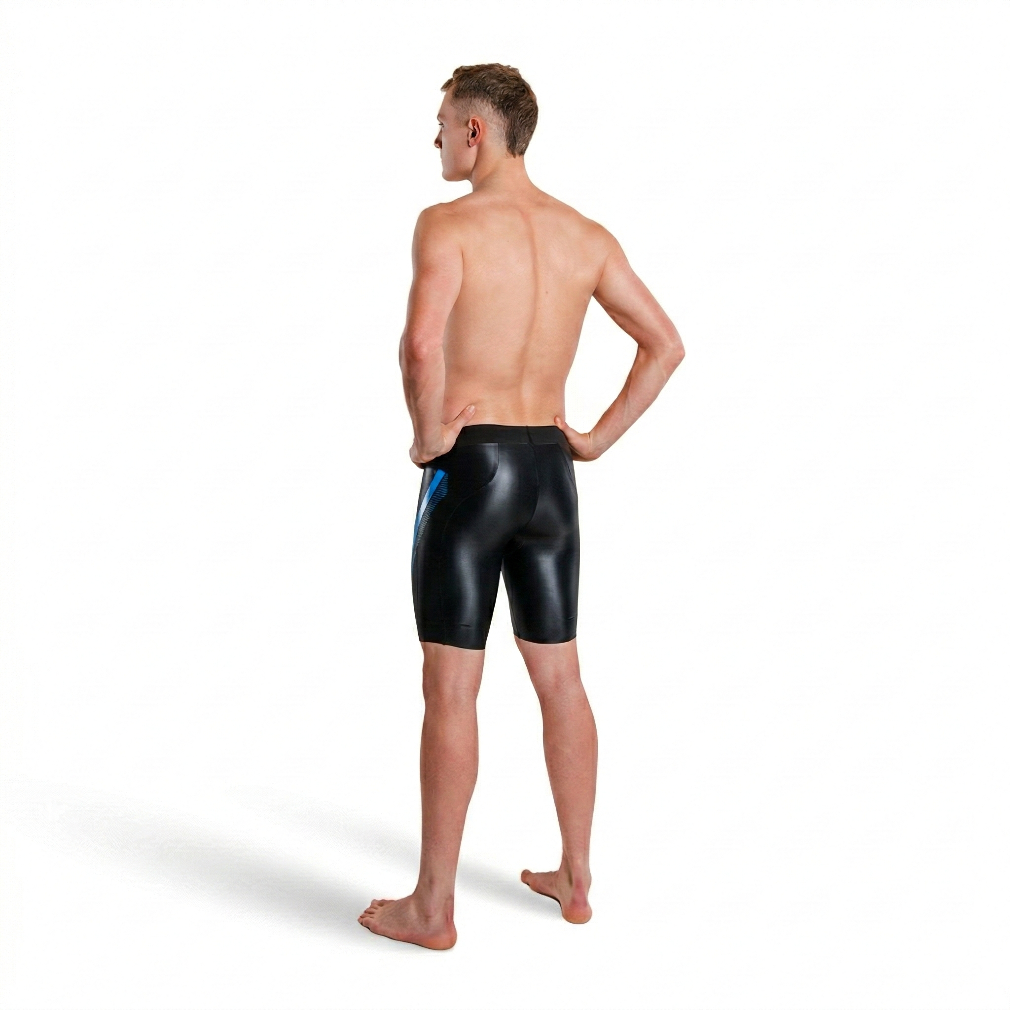 studio shot of a man wearing jammers from the back 