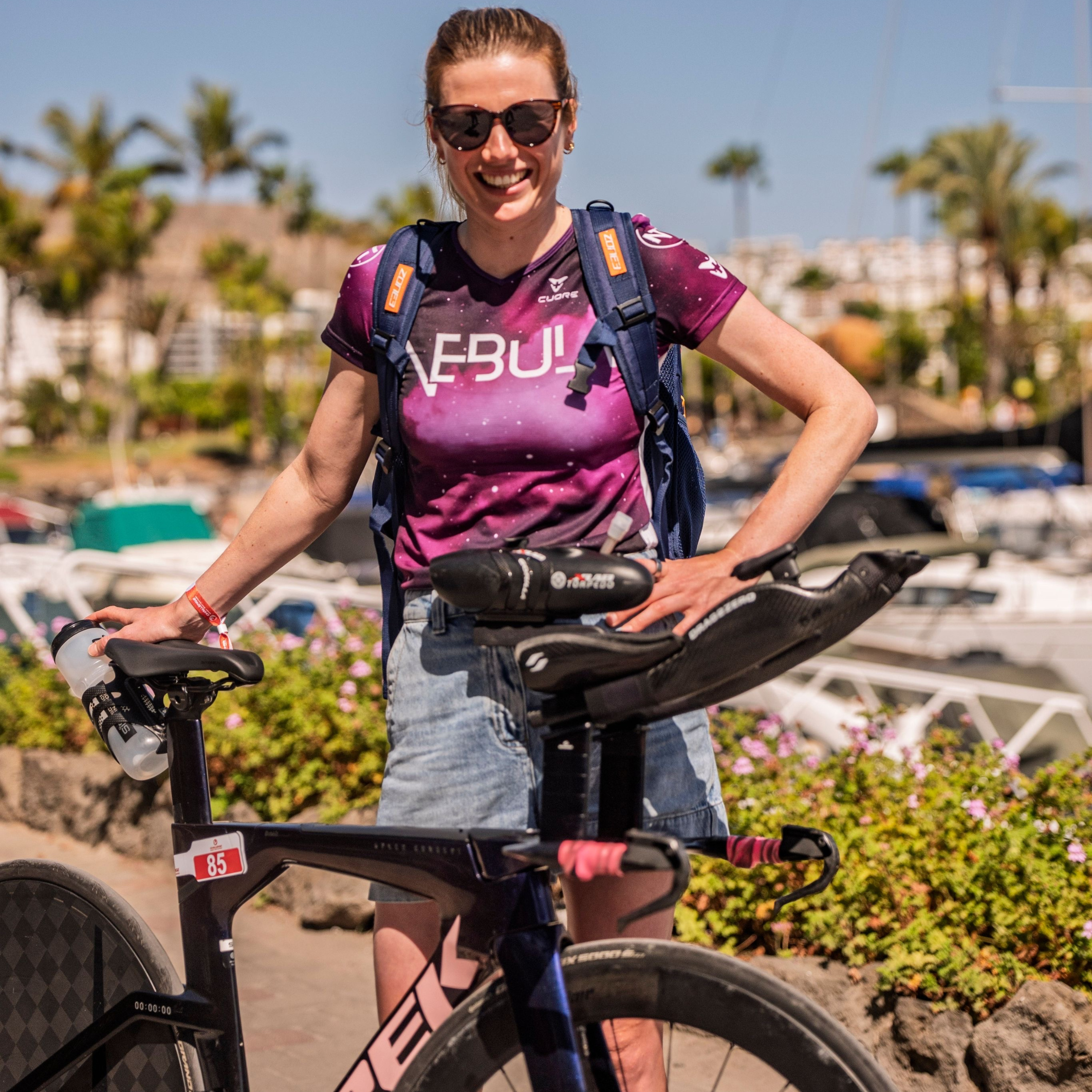 Woman with a bike in a scenic outdoor setting