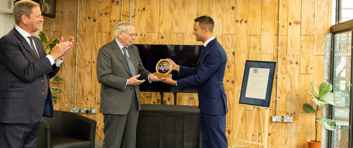 Image of the Lord lieutenant (left), Duke of Gloucestershire (centre) and James Lock (right). James is being handed the award for King's Award for Enterprise.