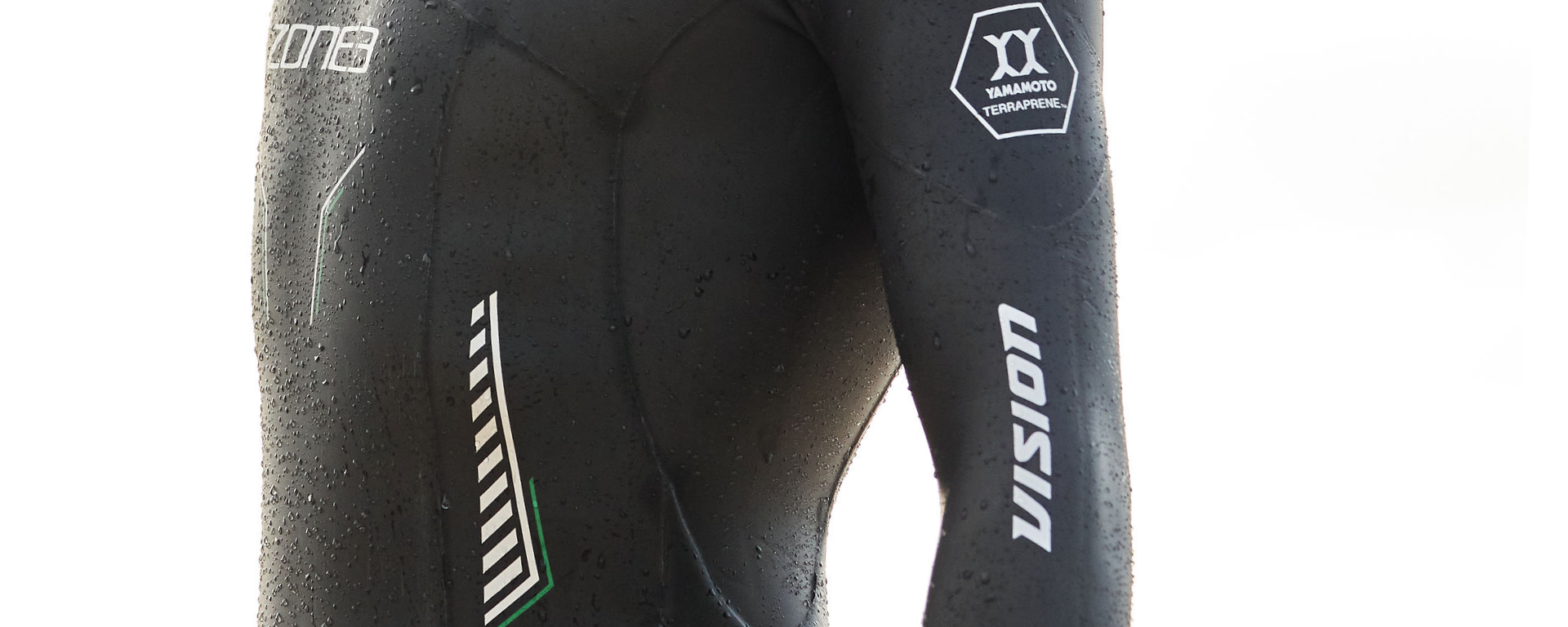 Man wearing Vision wetsuit close up to the material and the small details on the wetsuit 