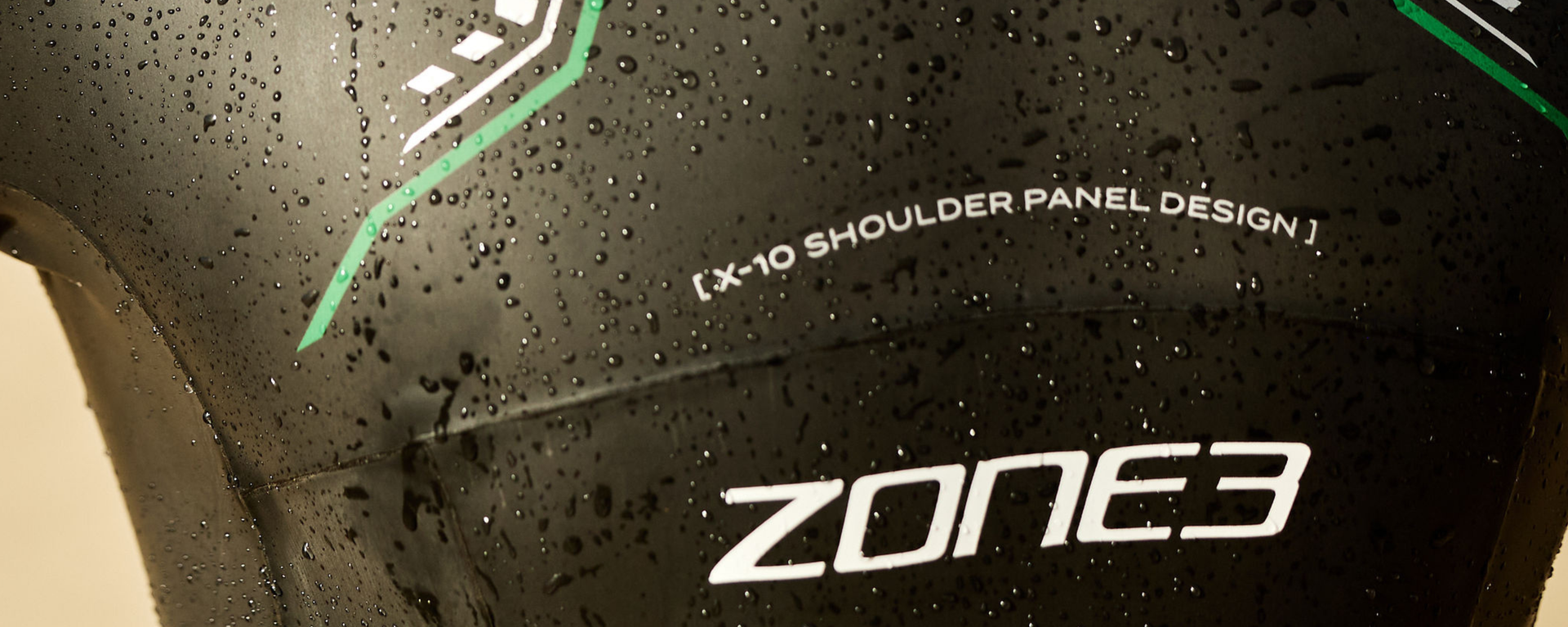 Zone3 swim suit with X-10 shoulder panel design on a wet surface