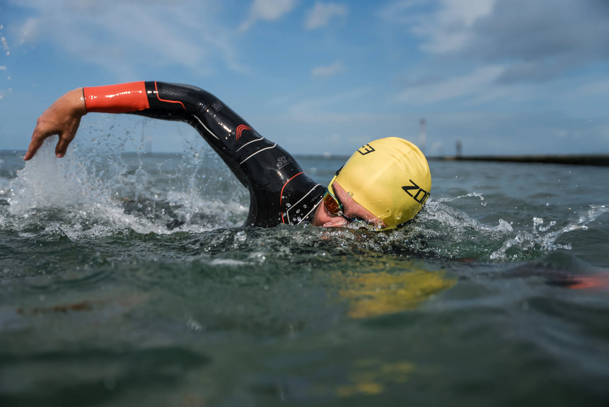 athlete swimming in open water wearing the Zone3 Vanquish-X wetsuit 