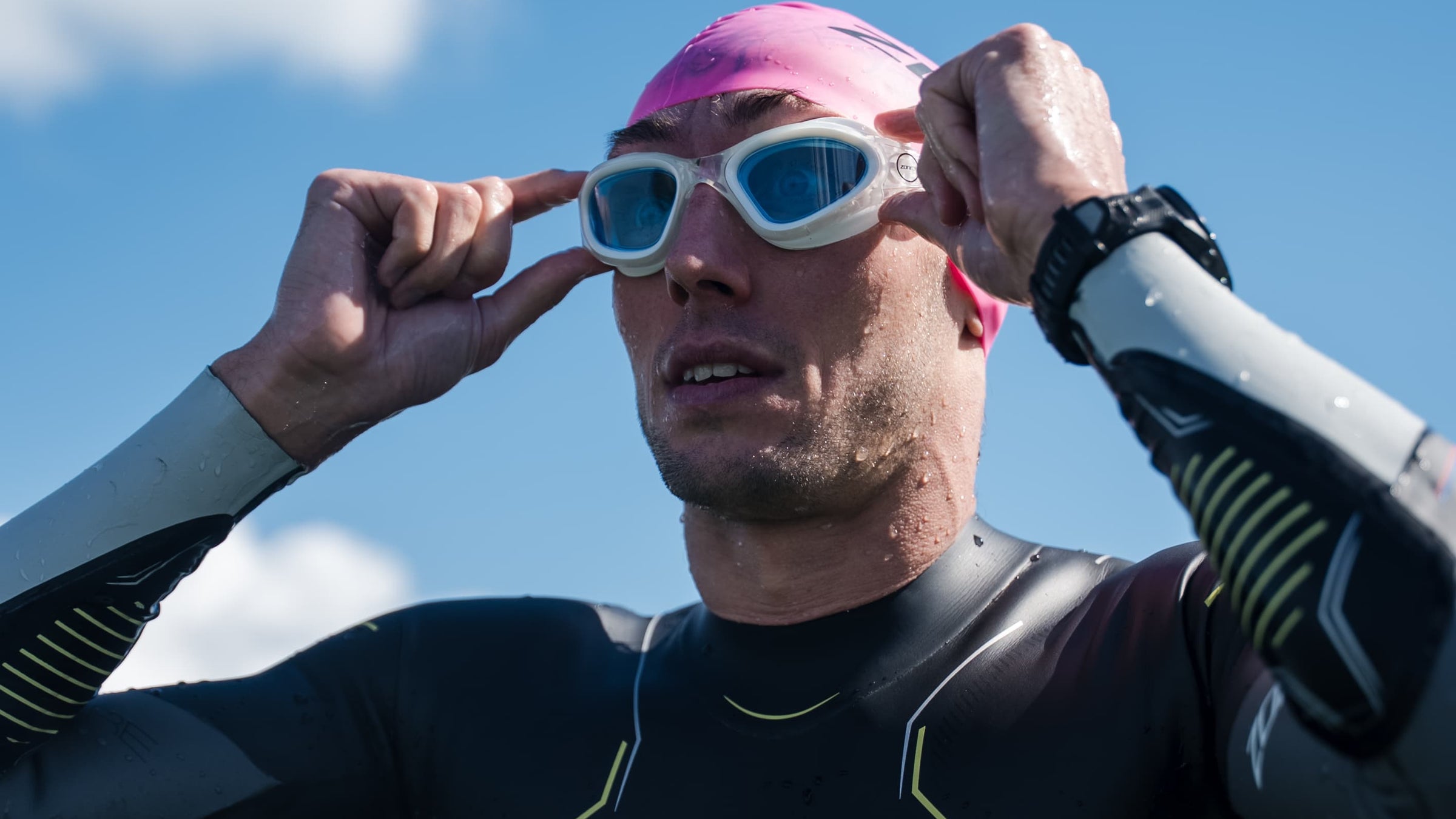 athlete wearing Zone3 Vapour goggles in blue clear in open water 