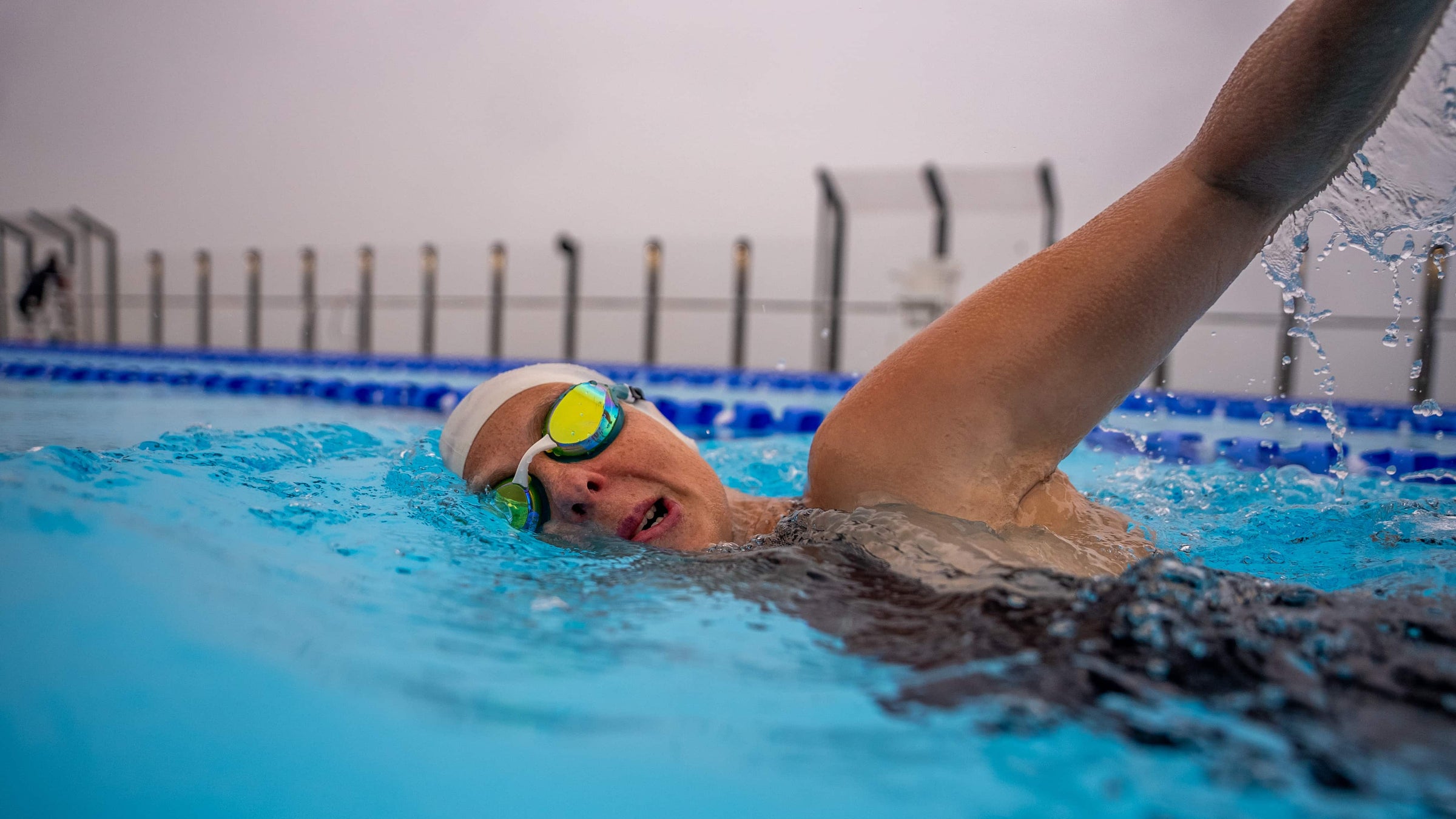female athlete wearing Volare Racing Swim Goggles while swimming in the pool 