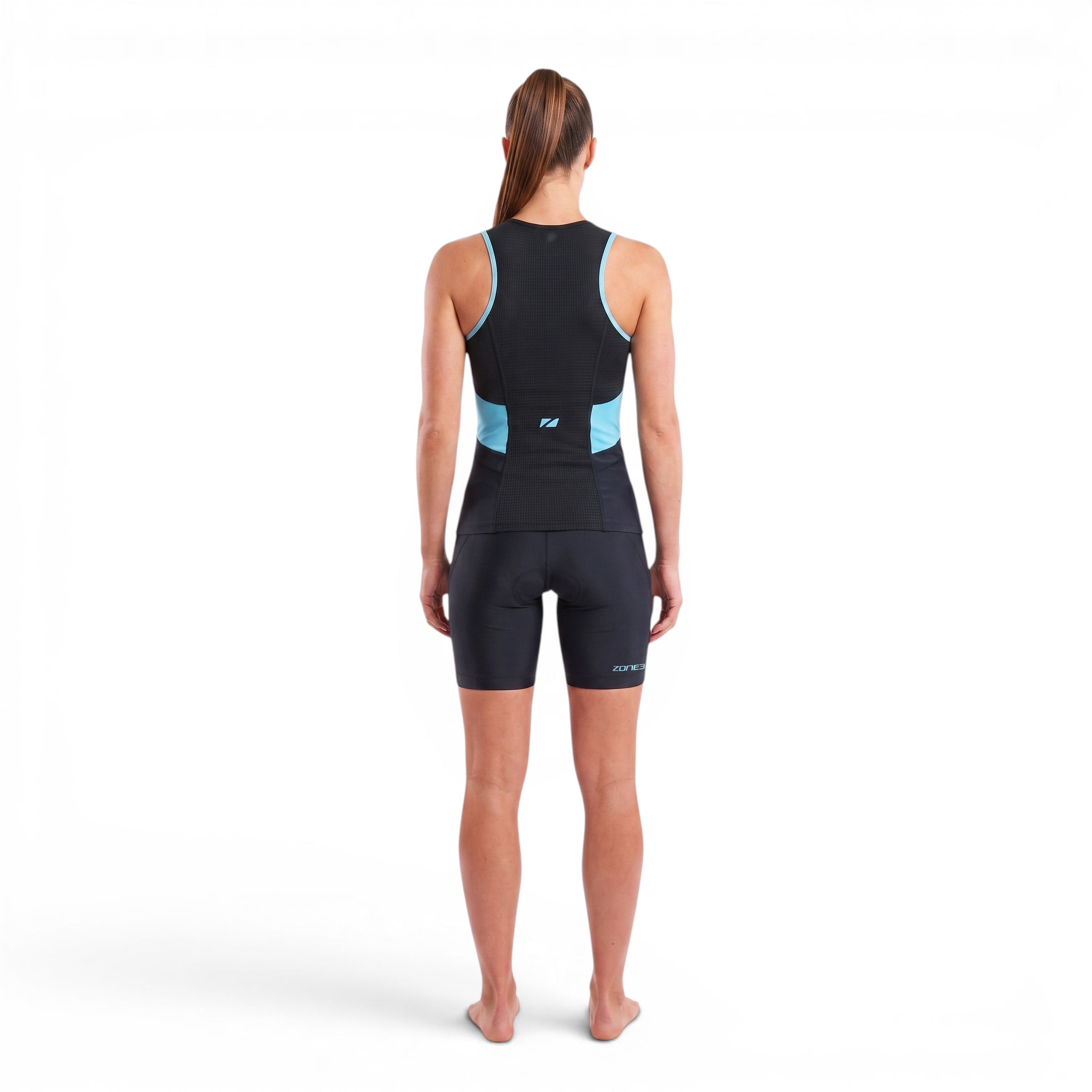 A woman wearing the Zone3 Activate tri shorts on a white background.