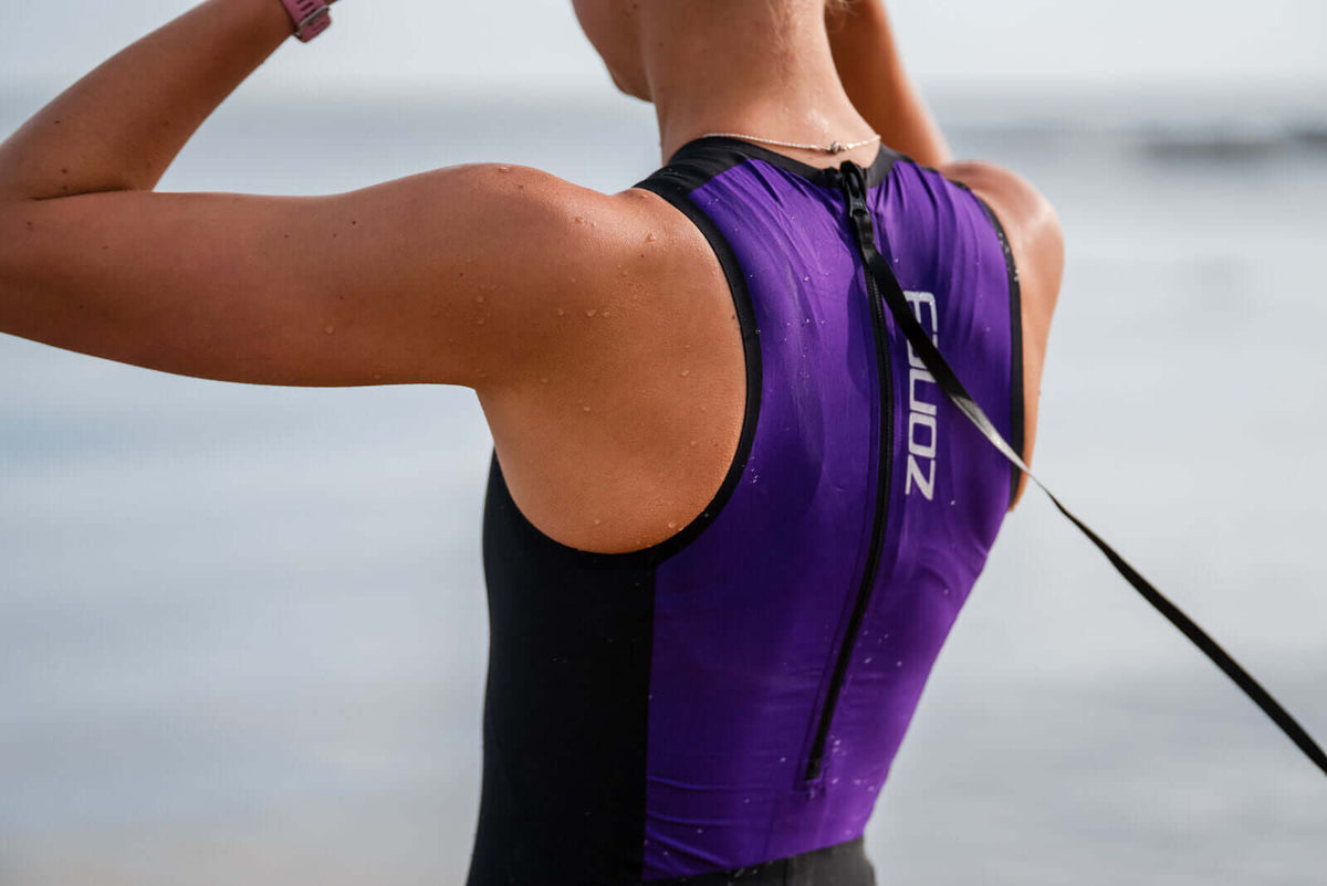 Close up of the back of the Zone3 Streamline_Swimskin at the beach.