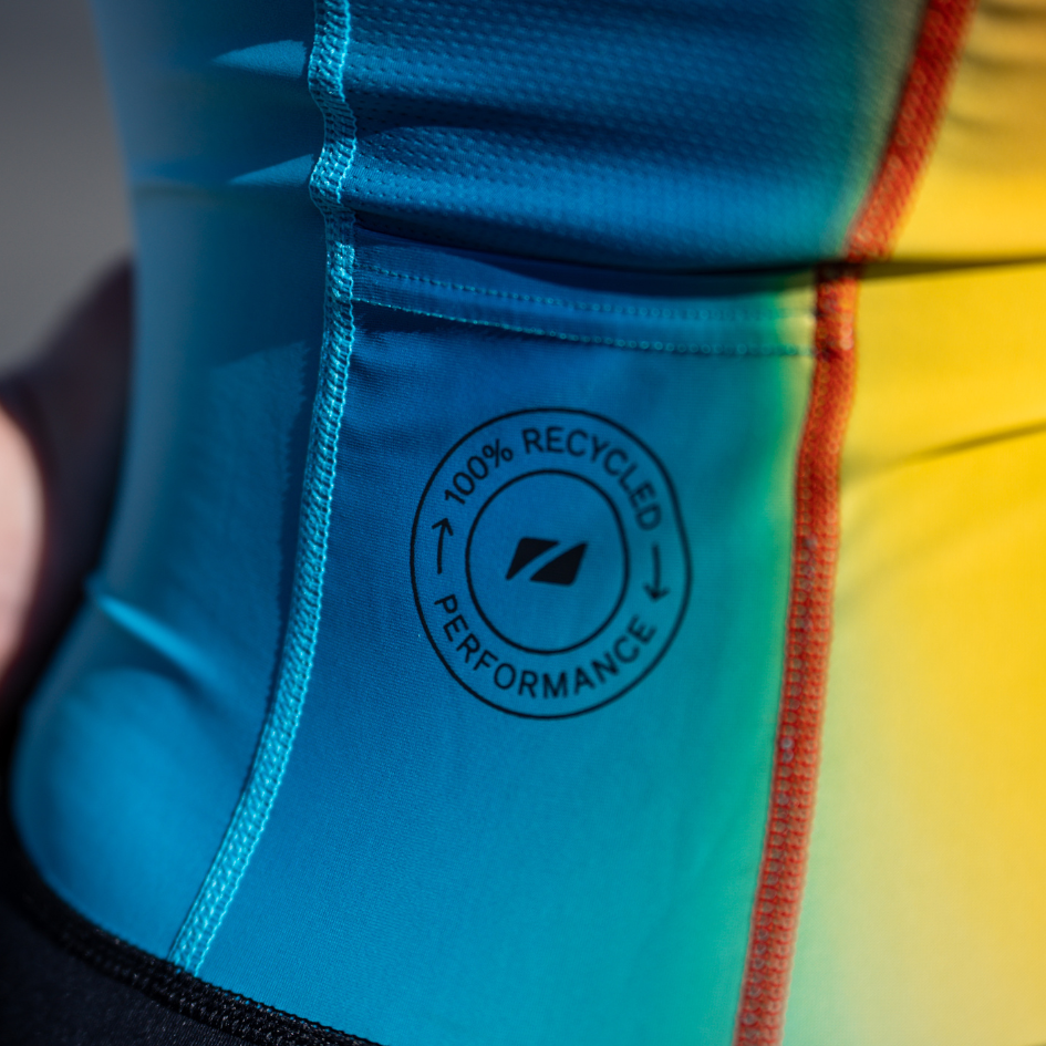 Close-up image of the ZONE3 2025 active plus trisuit. The focus of the image is on the 100% recycled badge which features on the rear of the trisuit.