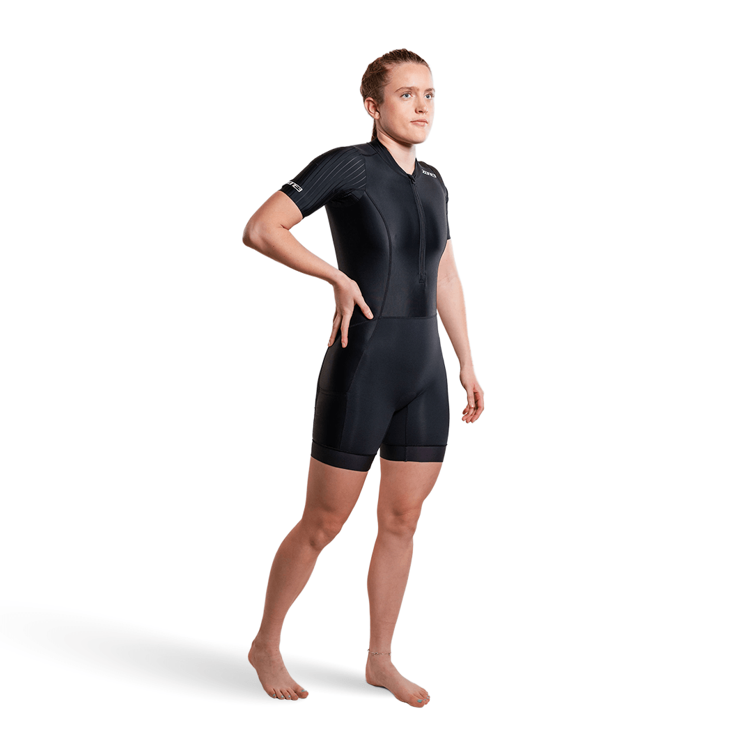 Person wearing a black trisuit on a white background