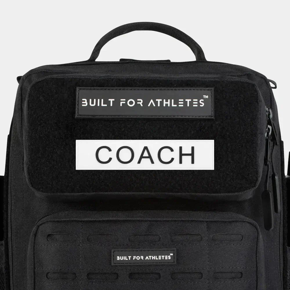 Built For Athletes Bag Patches on a transition bag featuring the label COACH.