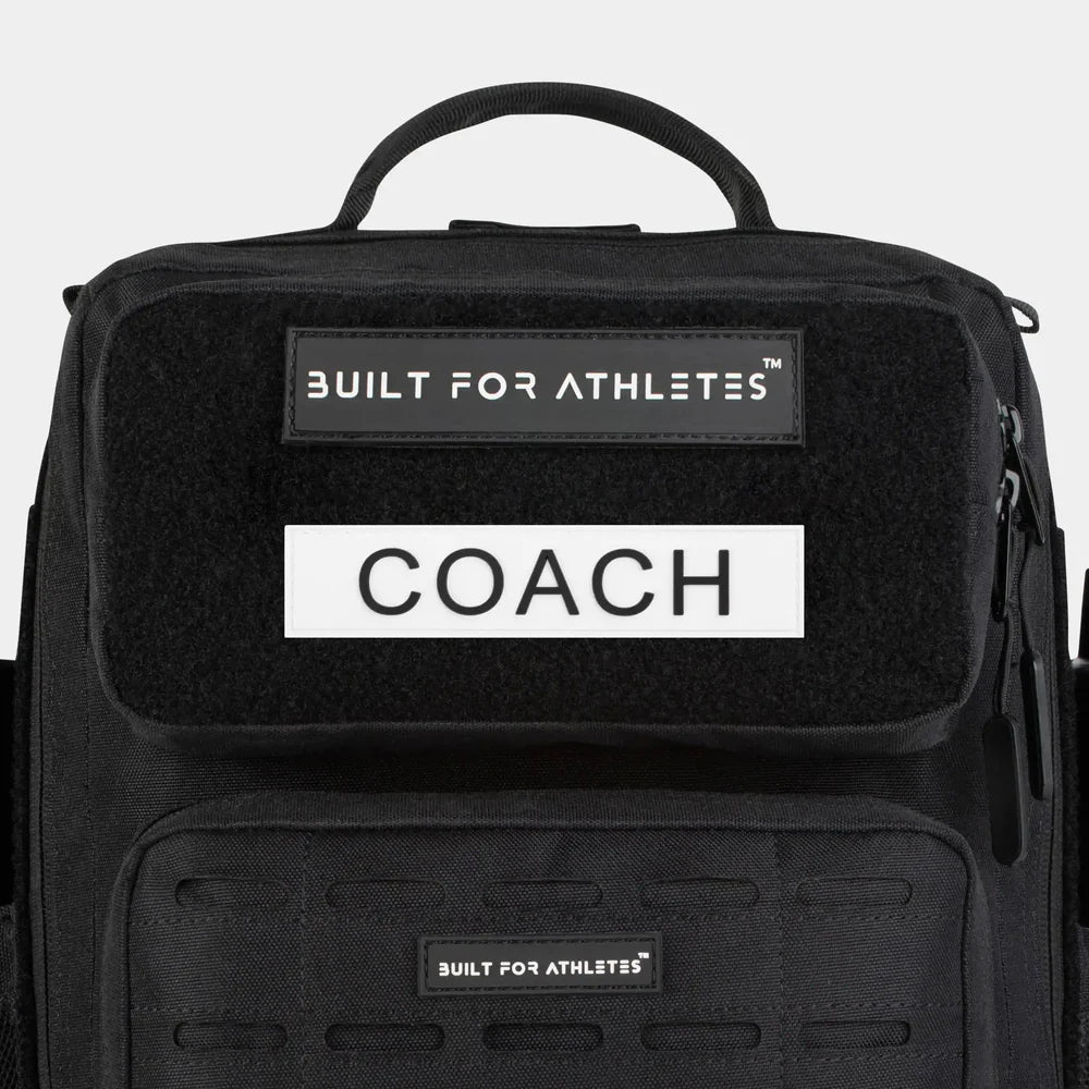 Built For Athletes Bag Patches on a transition bag featuring the label COACH.