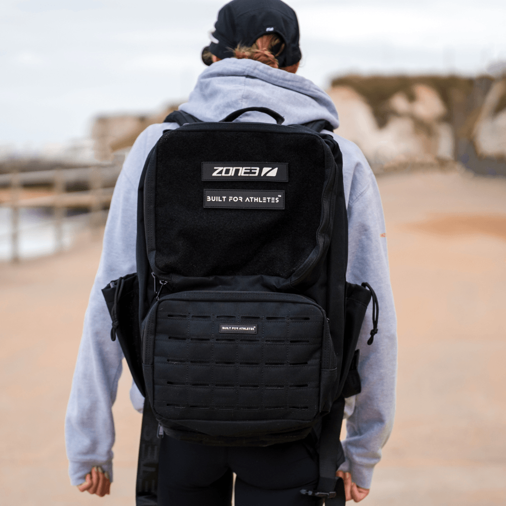 Built For Athletes x ZONE3 45L Transition Backpack worn by a triathlete in outdoor setting.