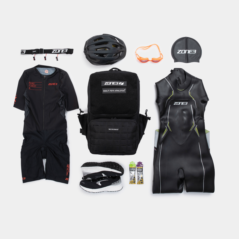 Collection of Zone3 triathlon gear including wetsuits, helmet, backpack, and accessories on a white background.