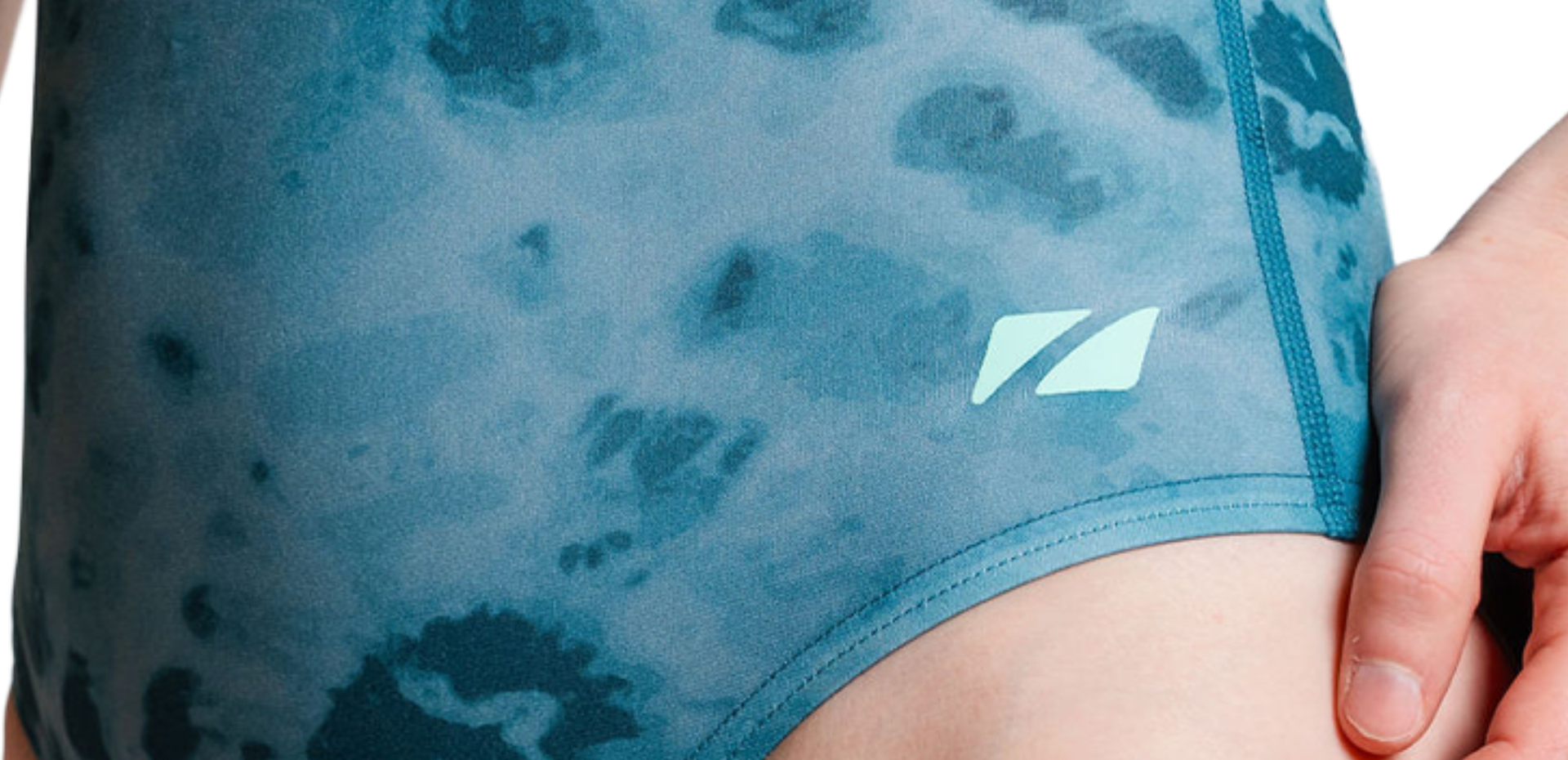 Teal tie-dye patterned high neck swimsuit on a white background