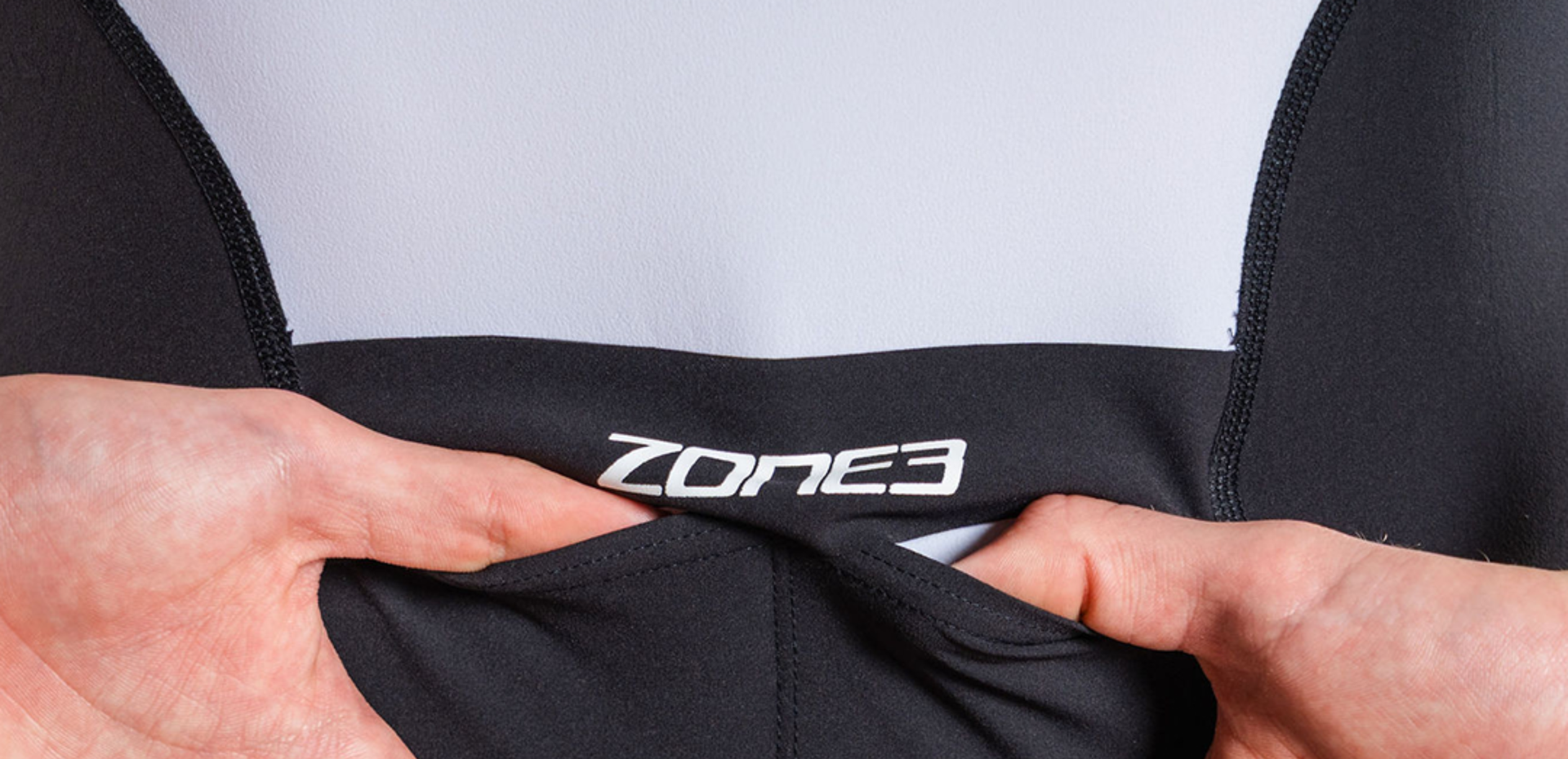 Close up of Lava Long Distance Full Zip Short Sleeve Trisuit on a white background  