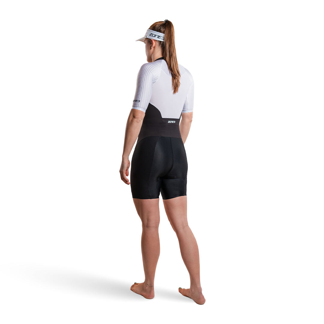 Woman wearing Lava Long Distance Full Zip Short Sleeve Trisuit on a white background  