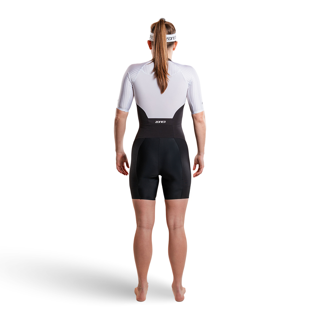 Woman wearing Lava Long Distance Full Zip Short Sleeve Trisuit on a white background  