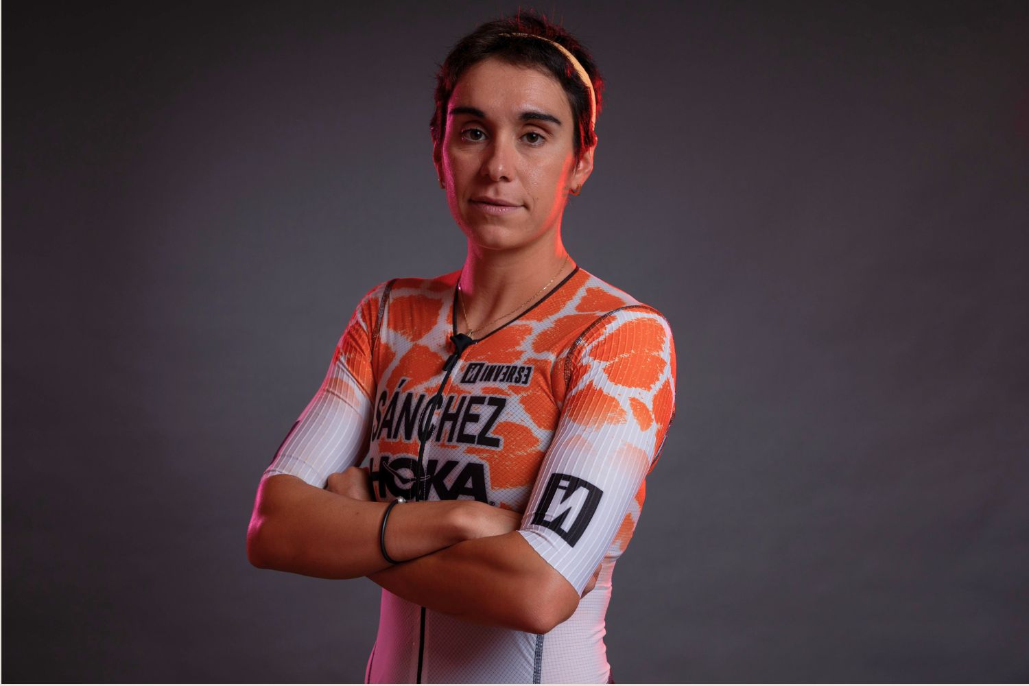 An Image of marta looking at the camera in a studio setting.