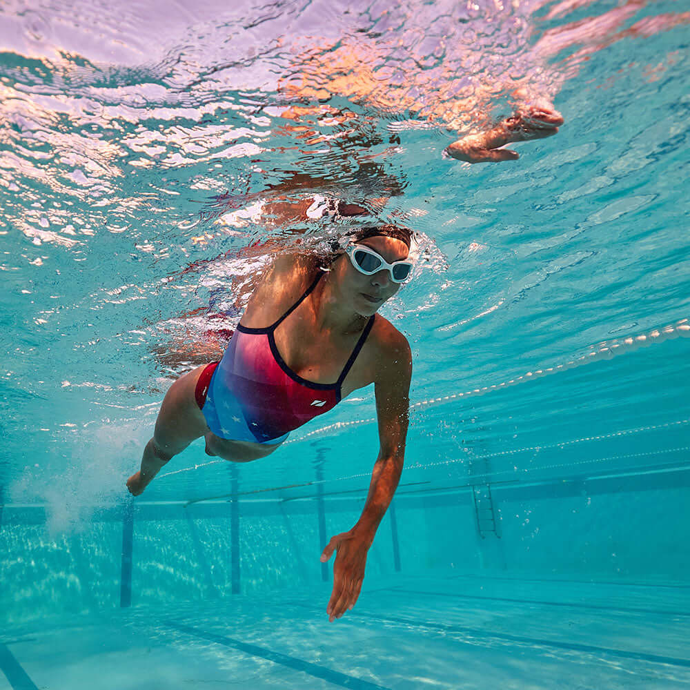 Swim Costume (USA) - A swimmer in action underwater, showcasing a vibrant swim suit design.